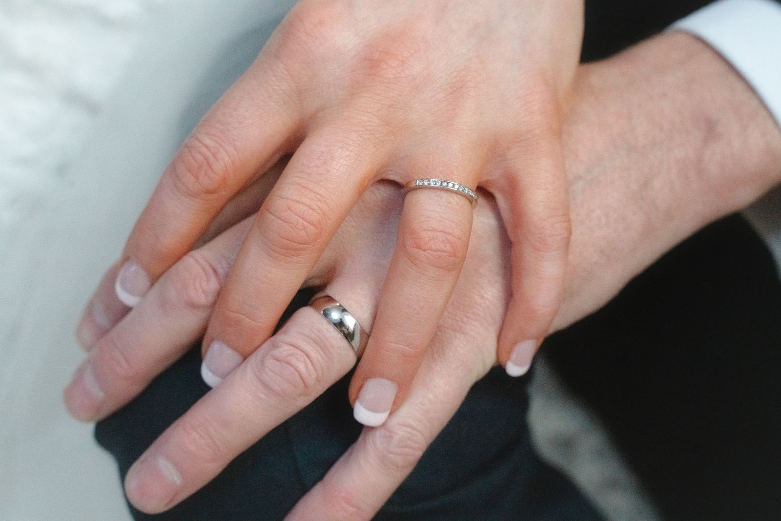 Macro shot of a sparkling diamond engagement ring and wedding band