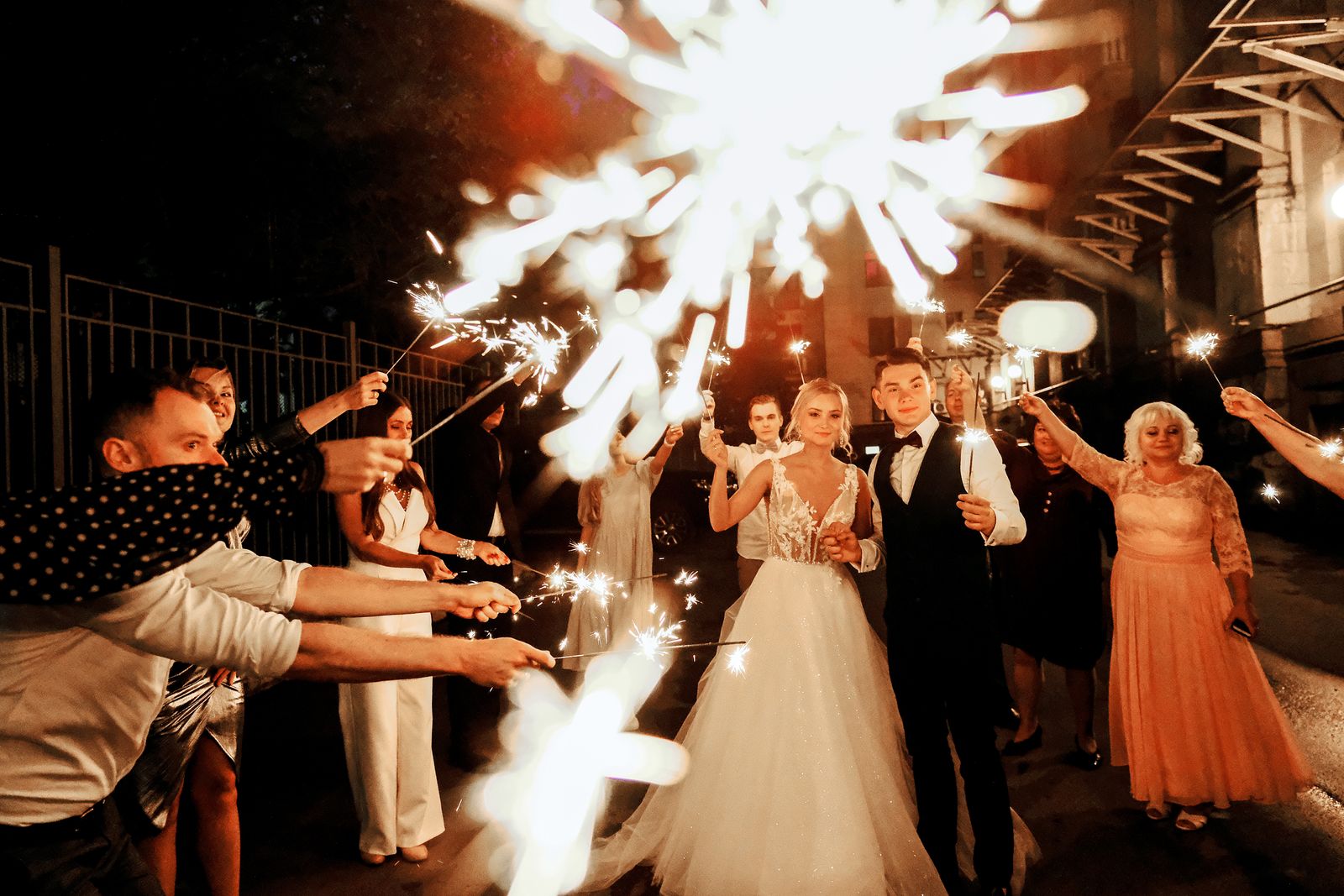 Joyful wedding guests celebrating together at the reception